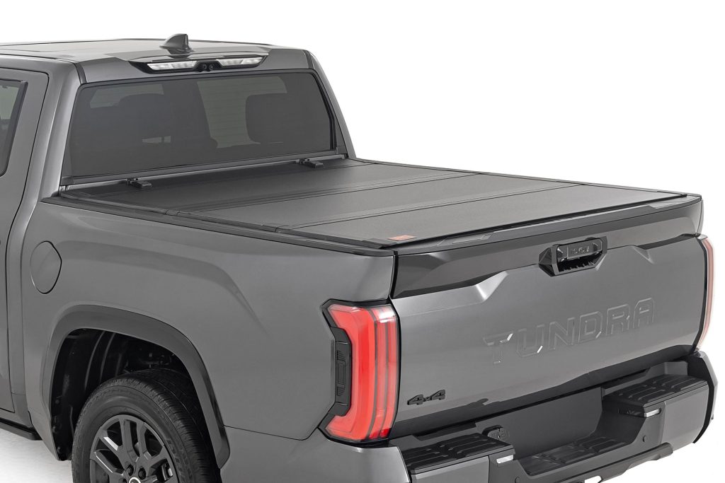 Rough Country Hard Tri-Fold Flip Up Bed Cover 5’7″ Toyota Tundra 2WD/4WD (2022-2026)