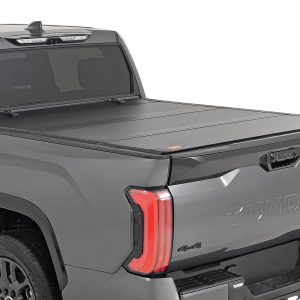 Rough Country Hard Tri-Fold Flip Up Bed Cover 5β7β³ Toyota Tundra 2WD/4WD (2022-2026)