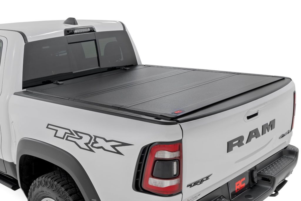 Rough Country Hard Tri-Fold Flip Up Bed Cover 6β4β³ Ram 1500 (19-26)/1500 TRX (21-24)