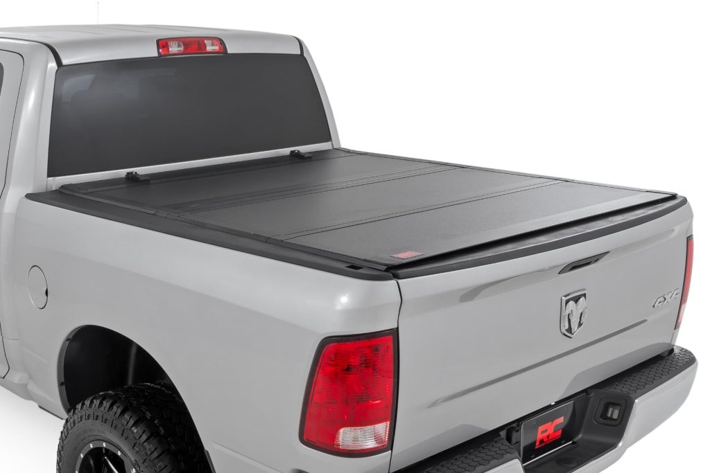 Rough Country Hard Tri-Fold Flip Up Bed Cover 5β7β³ Bed Ram 1500 2WD/4WD (2009-2018 & Classic)