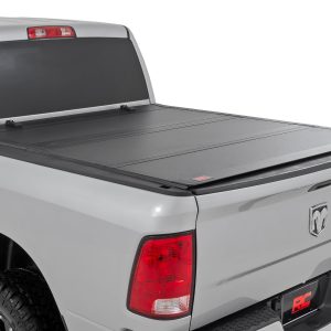 Rough Country Hard Tri-Fold Flip Up Bed Cover 5β7β³ Bed Ram 1500 2WD/4WD (2009-2018 & Classic)