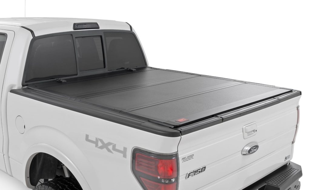 Rough Country Hard Tri-Fold Flip Up Bed Cover 5’7″ Bed Ford F-150 2WD/4WD (2004-2014)